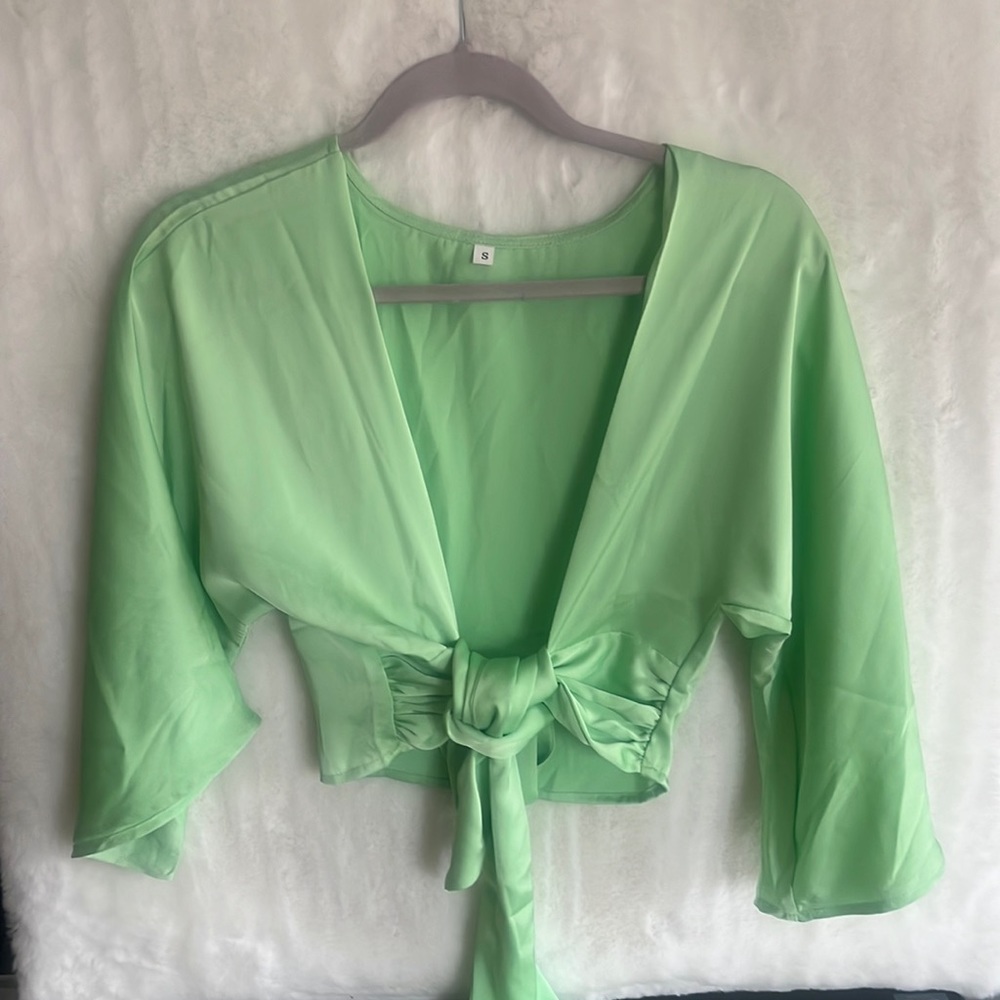 Beautiful, lime green cropped around the stomach shirt